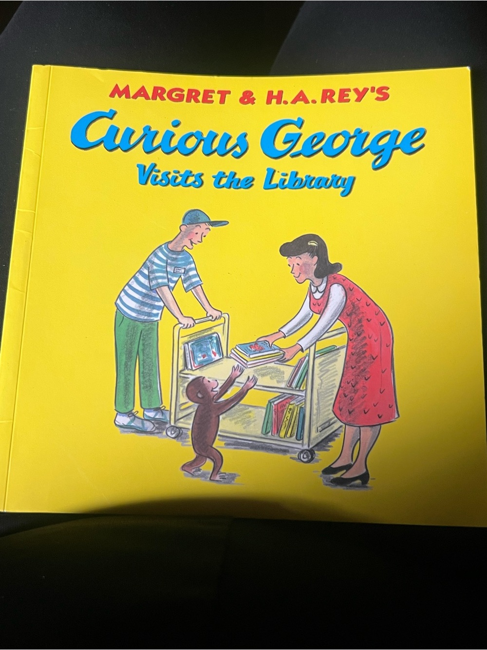 Soft cover curious George visits the library children’s